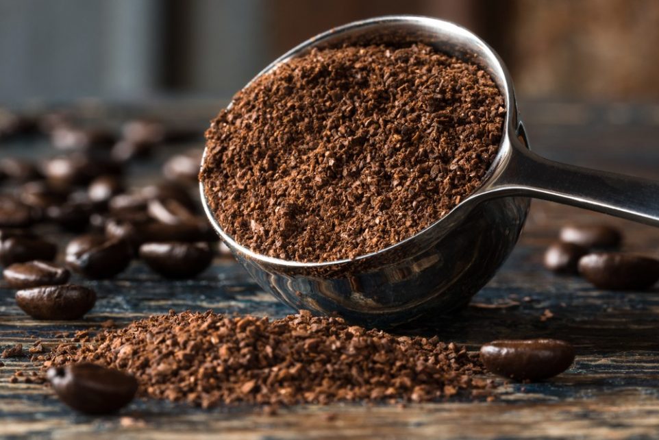 Ground Coffee Beans Spilled from a Coffee Scoop